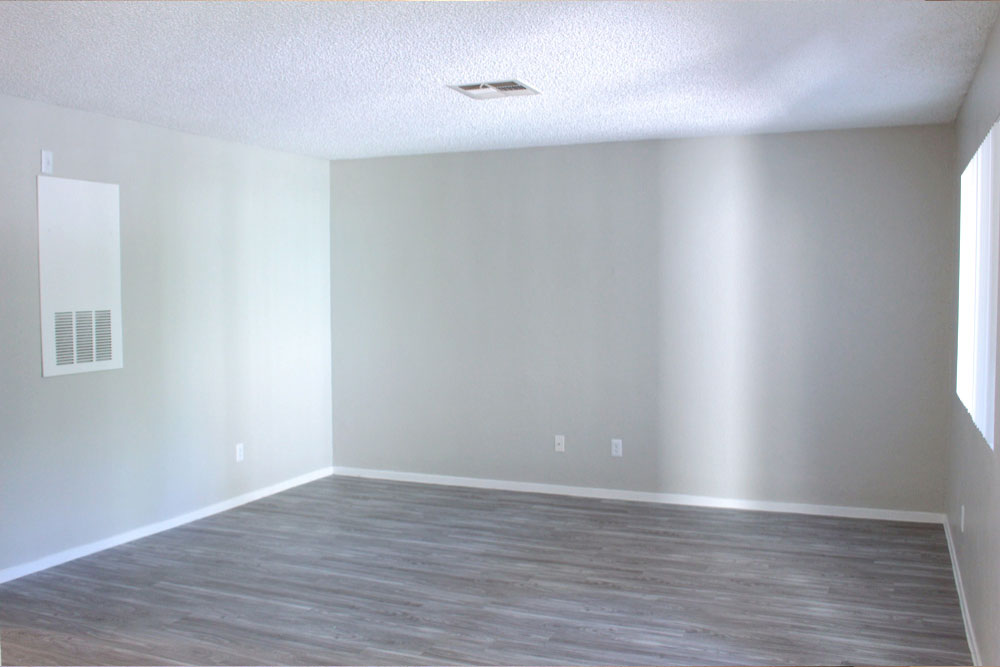 Living room with carpet and slider doors